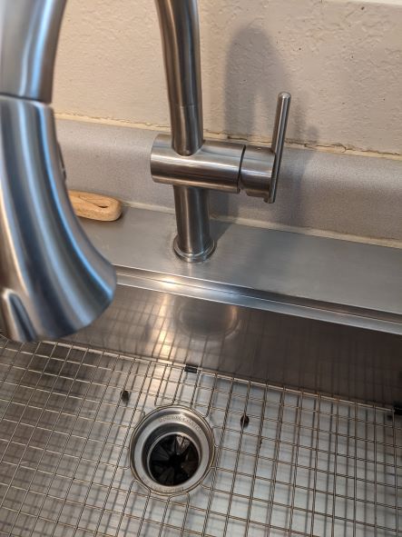 Discoloration on stainless steel faucet - cleaners came through